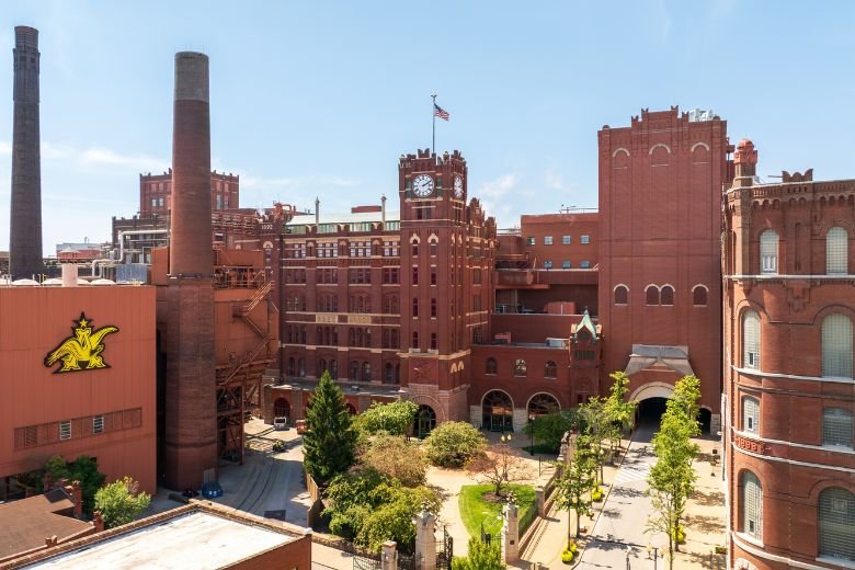 Anheuser-Busch brewery, St Louis · historic brick complex with twin smokestacks and clock tower